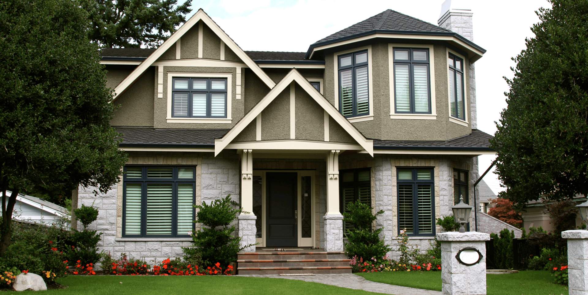 Elegant two-story house with manicured front yard